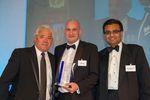 Mat Jane (middle) receiving his award from host Kevin Keegan (left) and Manoj Styche-Patel (right)
